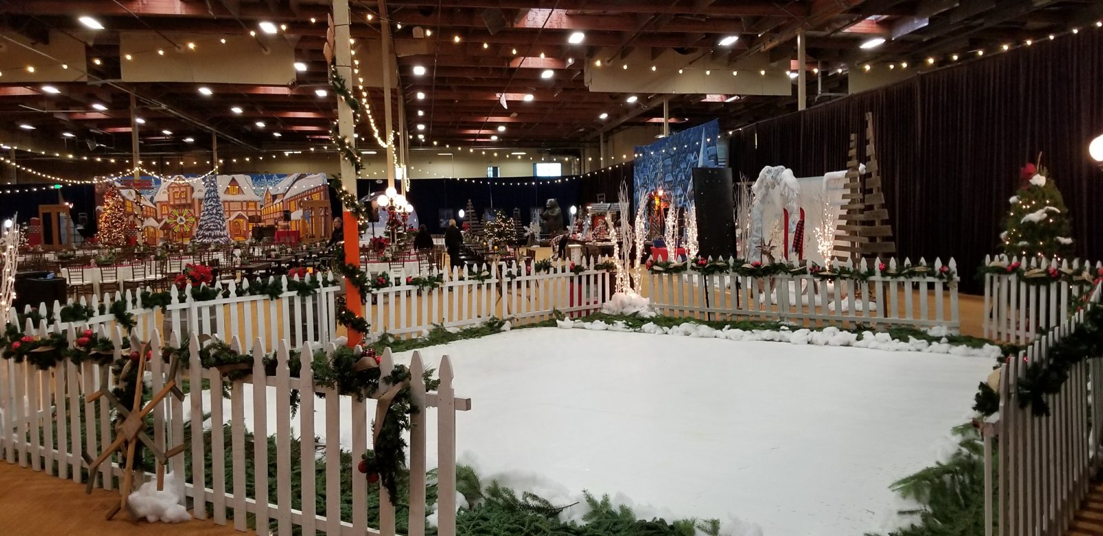 Indoor synthetic ice rink decorated for a holiday event