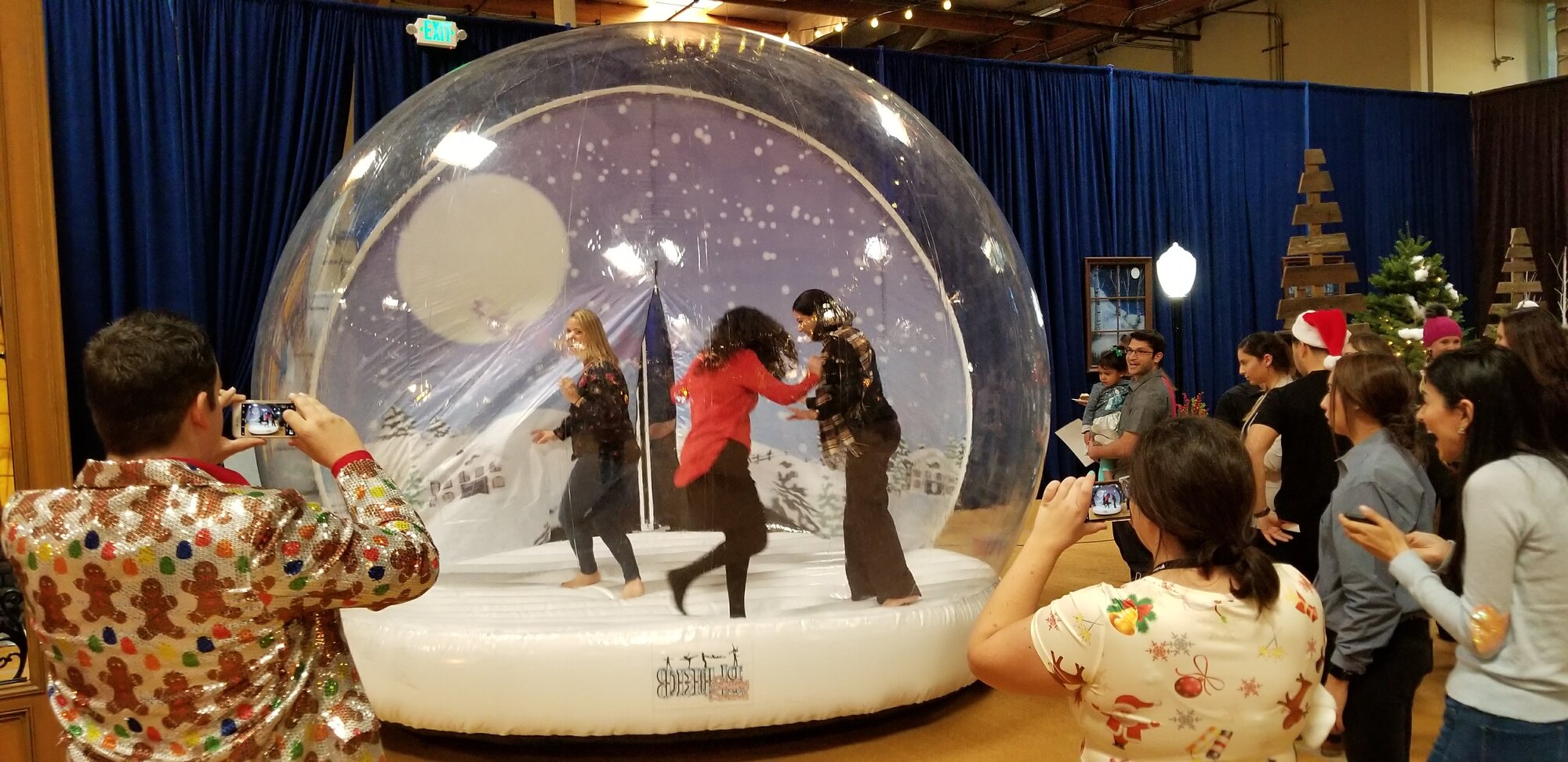 Guests playing inside the giant inflatable snow globe